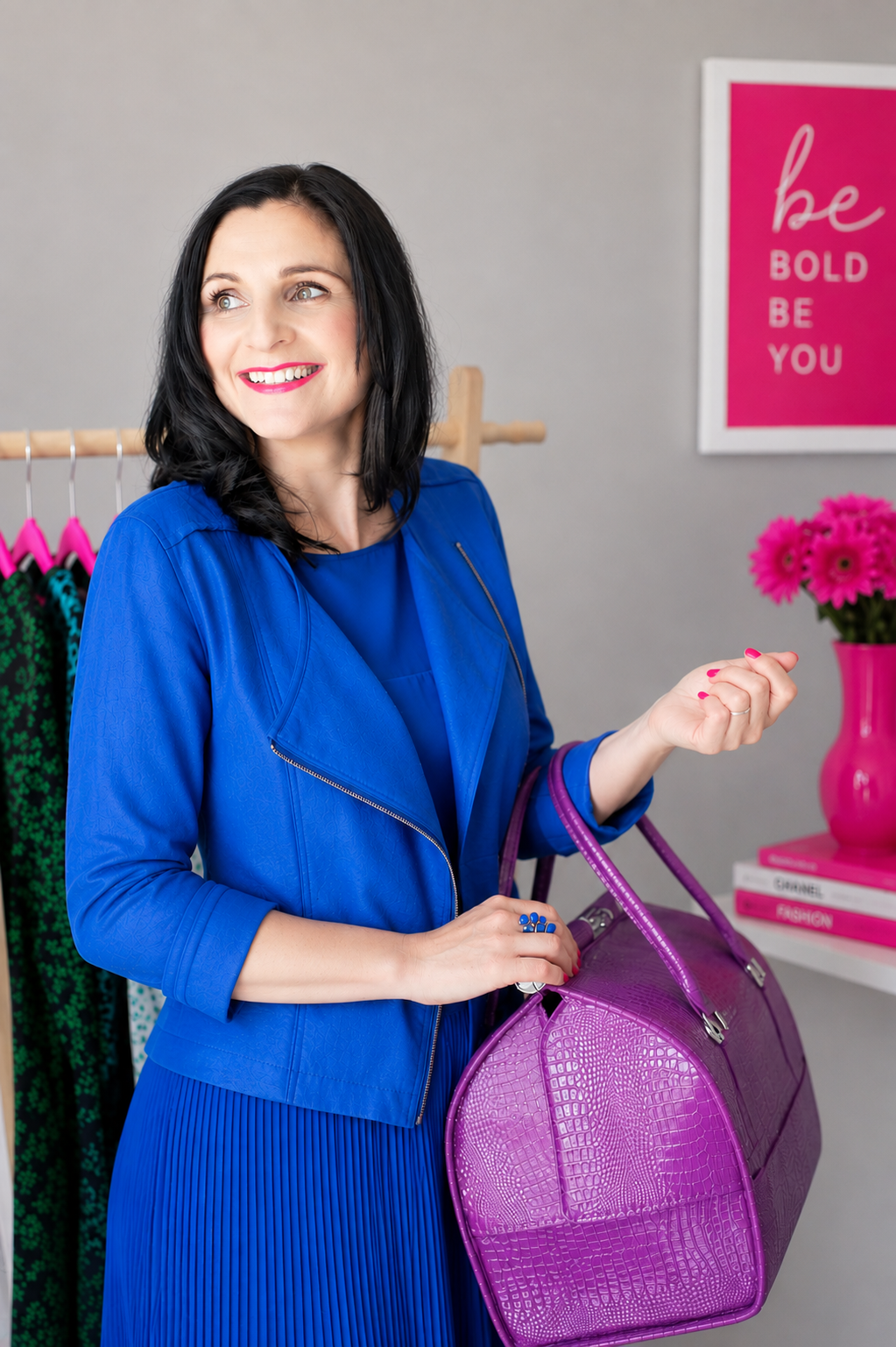 Anna Phillips browsing a wardrobe edit with her signature pink clothing hangers